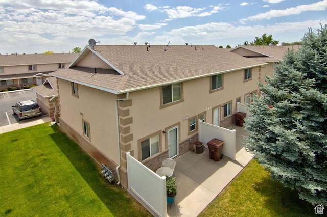 262 W 1975 N Unit 40, Ogden, UT 84414 - rear view of property with stucco siding, a shingled roof, and a patio area