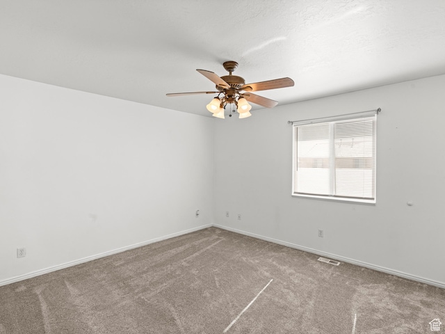 262 W 1975 N Unit 40, Ogden, UT 84414 - carpeted empty room featuring visible vents, a textured ceiling, baseboards, and a ceiling fan