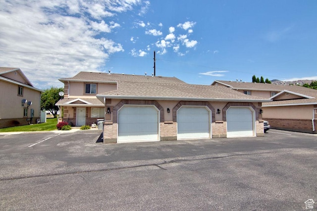 262 W 1975 N Unit 40, Ogden, UT 84414 - multi unit property featuring roof with shingles and brick siding