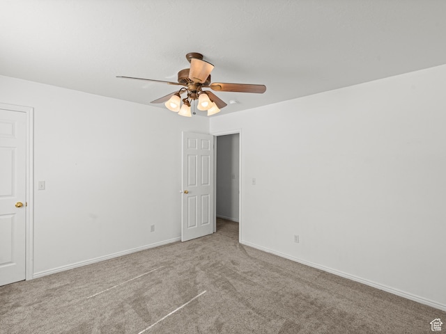 262 W 1975 N Unit 40, Ogden, UT 84414 - unfurnished room with light carpet, baseboards, and a ceiling fan