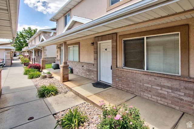 262 W 1975 N Unit 40, Ogden, UT 84414 - doorway to property featuring covered porch