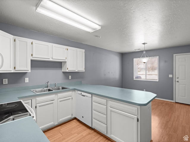 262 W 1975 N Unit 40, Ogden, UT 84414 - kitchen with a peninsula, white cabinets, pendant lighting, and dishwasher