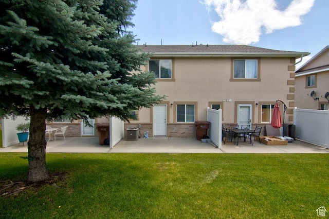 262 W 1975 N Unit 40, Ogden, UT 84414 - rear view of property with a patio area, stucco siding, and brick siding