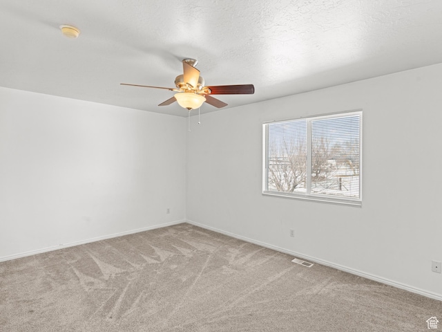 262 W 1975 N Unit 40, Ogden, UT 84414 - unfurnished room featuring a ceiling fan, light carpet, a textured ceiling, and baseboards