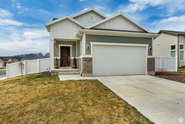 6393 N Pine Tree Way, Eagle Mountain, UT 84005 - craftsman inspired home featuring concrete driveway, fence, board and batten siding, and a garage