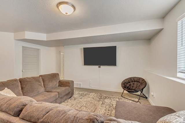 6393 N Pine Tree Way, Eagle Mountain, UT 84005 - carpeted living room featuring baseboards, visible vents, and a textured ceiling