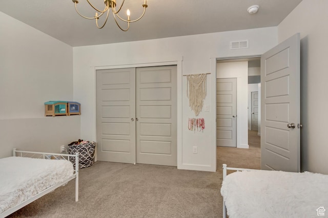 6393 N Pine Tree Way, Eagle Mountain, UT 84005 - bedroom featuring a closet, visible vents, an inviting chandelier, and light carpet