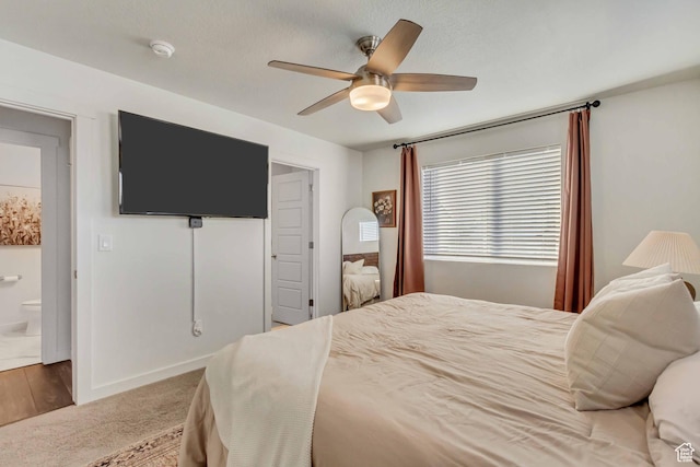 6393 N Pine Tree Way, Eagle Mountain, UT 84005 - bedroom featuring carpet floors, ensuite bath, baseboards, and ceiling fan