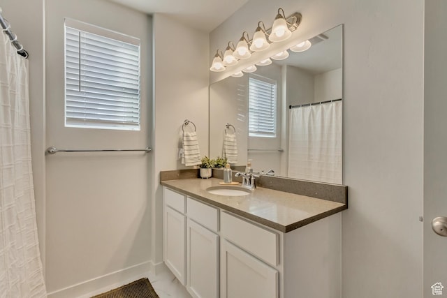 6393 N Pine Tree Way, Eagle Mountain, UT 84005 - full bathroom featuring baseboards and vanity
