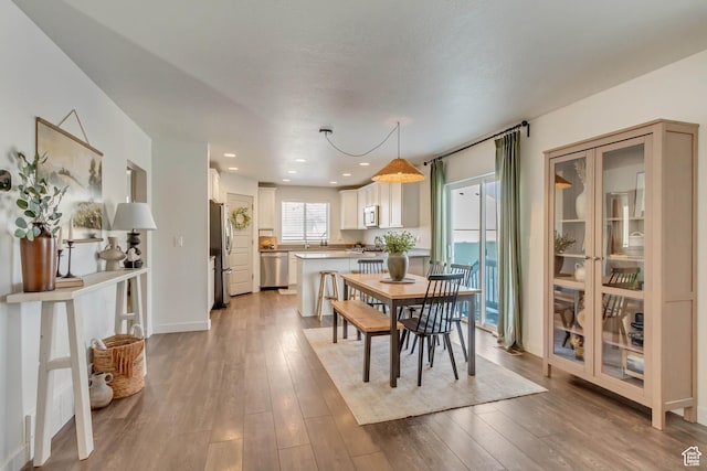 6393 N Pine Tree Way, Eagle Mountain, UT 84005 - dining space with recessed lighting, baseboards, and light wood-type flooring