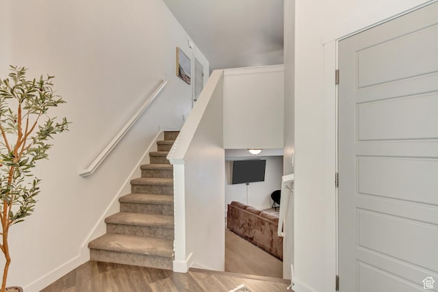 6393 N Pine Tree Way, Eagle Mountain, UT 84005 - stairway with baseboards and wood finished floors