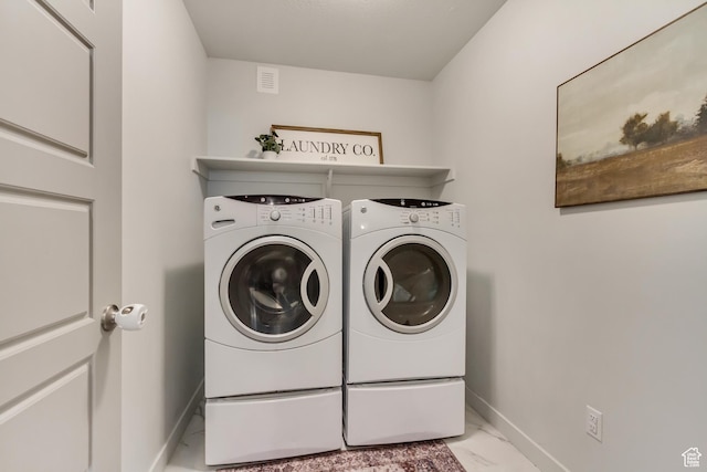6393 N Pine Tree Way, Eagle Mountain, UT 84005 - laundry room with marble finish floor, baseboards, washing machine and clothes dryer, and laundry area