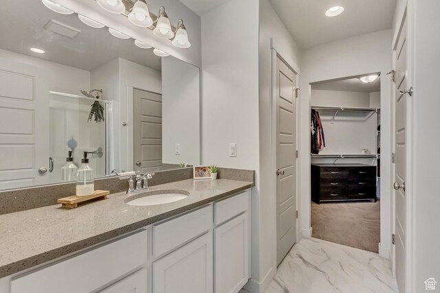 6393 N Pine Tree Way, Eagle Mountain, UT 84005 - full bathroom with vanity, recessed lighting, a spacious closet, marble finish floor, and walk in shower