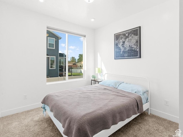 bedroom with recessed lighting, carpet flooring, and baseboards