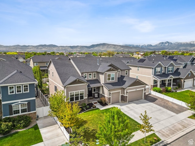 aerial perspective of suburban area with a mountainous background