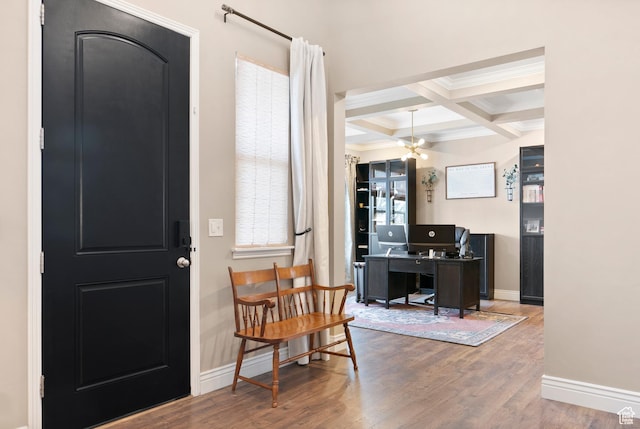 foyer entrance featuring coffered ceiling, beam ceiling, wood finished floors, baseboards, and ornamental molding