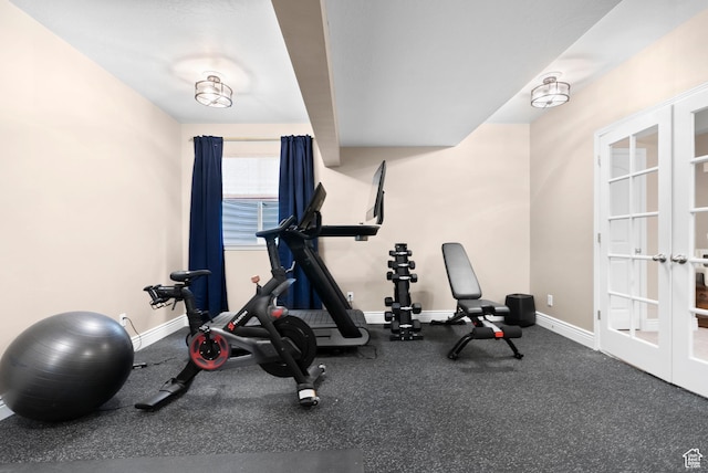 exercise room featuring french doors and baseboards