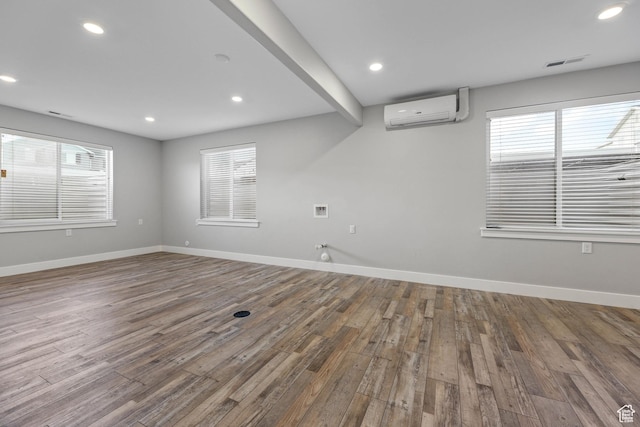 5436 W 9120 S, West Jordan, UT 84081 - spare room featuring an AC wall unit, wood finished floors, baseboards, and recessed lighting
