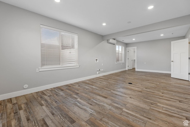 5436 W 9120 S, West Jordan, UT 84081 - spare room with a wall mounted air conditioner, light wood-style flooring, baseboards, and recessed lighting