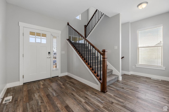 5436 W 9120 S, West Jordan, UT 84081 - foyer entrance with dark wood finished floors, baseboards, and stairway