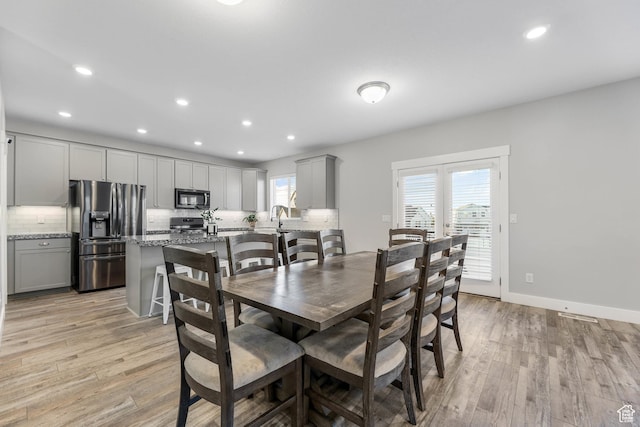 5436 W 9120 S, West Jordan, UT 84081 - dining area featuring light wood-style flooring, recessed lighting, and baseboards