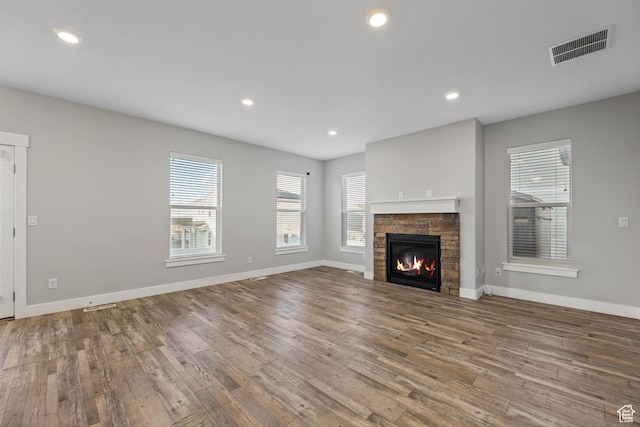 5436 W 9120 S, West Jordan, UT 84081 - unfurnished living room with wood finished floors, a fireplace, baseboards, and recessed lighting