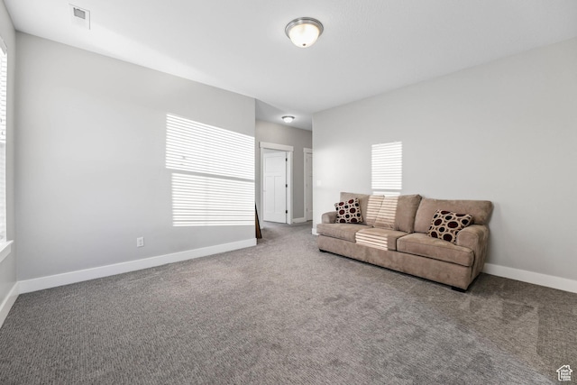 5436 W 9120 S, West Jordan, UT 84081 - carpeted living room featuring healthy amount of natural light and baseboards