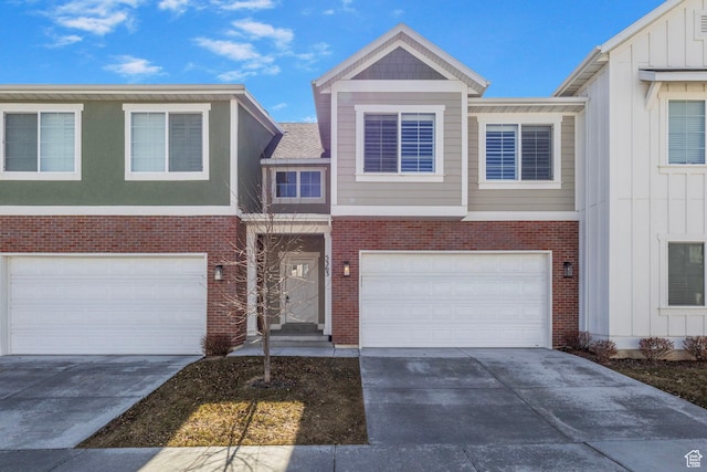 view of front of home featuring brick siding, driveway, and an attached garage