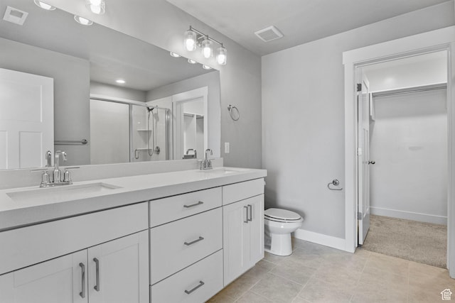 full bath featuring visible vents, a shower stall, and a sink
