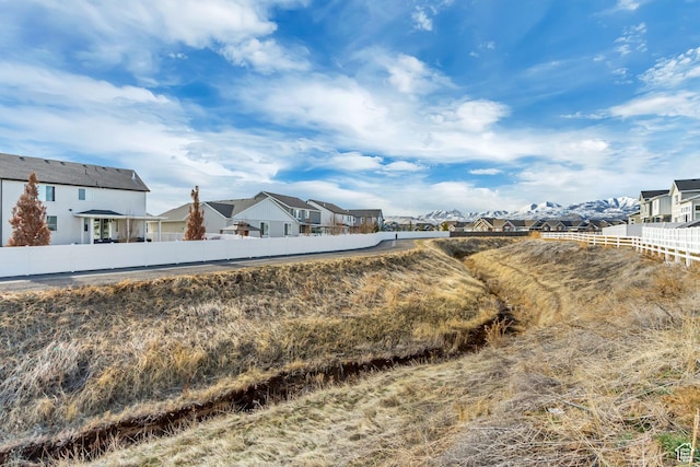 view of yard featuring a residential view and fence