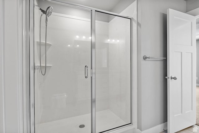 bathroom featuring a shower stall