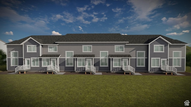 rear view of property featuring a yard