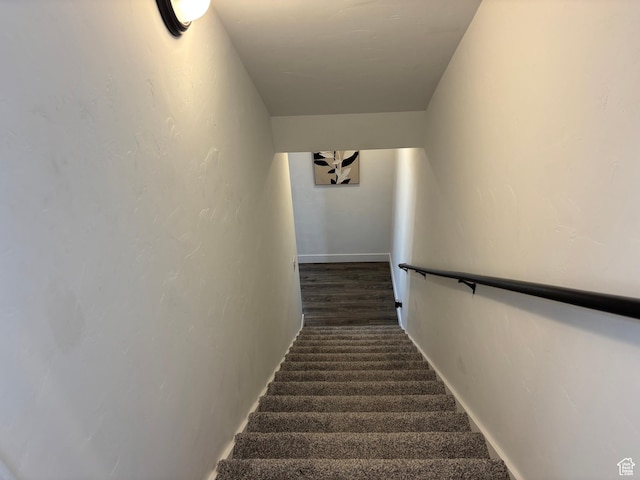 stairway featuring baseboards