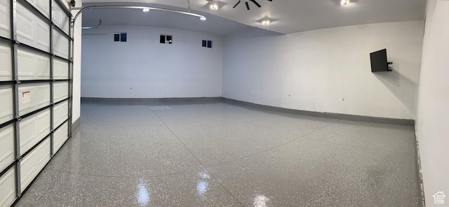 empty room featuring speckled floor and baseboards