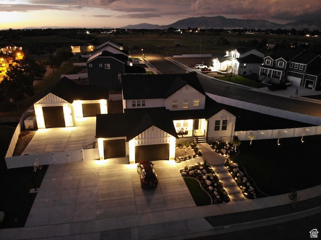 birds eye view of property with a mountain view