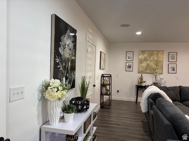 corridor featuring recessed lighting, baseboards, and dark wood-style floors