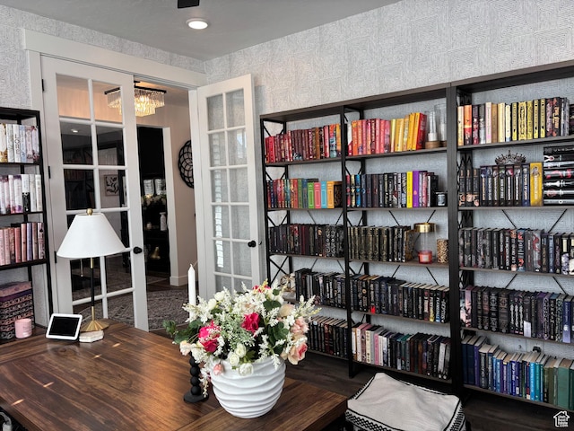 interior space featuring a chandelier and french doors