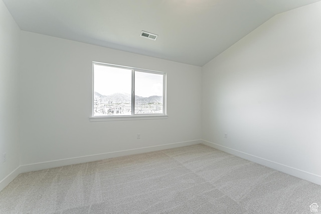 706 W 4500 S Unit 307, Mapleton, UT 84664 - spare room with light colored carpet, lofted ceiling, and baseboards