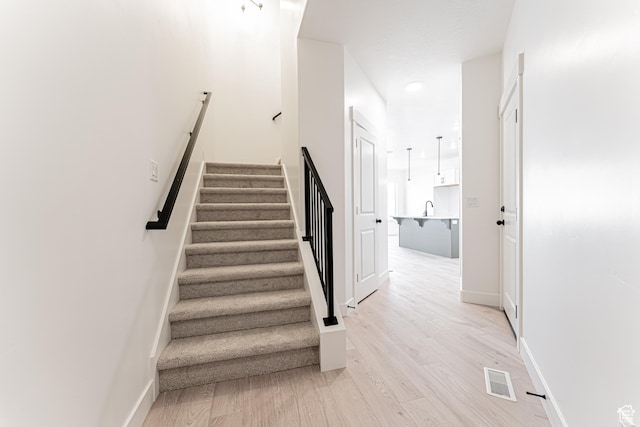 706 W 4500 S Unit 307, Mapleton, UT 84664 - staircase with wood finished floors and baseboards