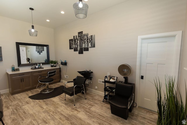 living area with recessed lighting, light wood-style flooring, and baseboards