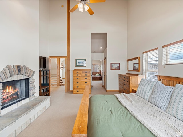 1173 S Innsbruck Dr, Huntsville, UT 84317 - bedroom featuring a fireplace, a towering ceiling, carpet, and baseboards