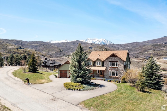 1173 S Innsbruck Dr, Huntsville, UT 84317 - view of front of property featuring driveway, a mountain view, and a front lawn