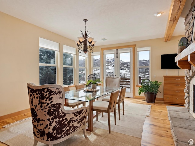 1173 S Innsbruck Dr, Huntsville, UT 84317 - dining room featuring baseboards, a notable chandelier, a wealth of natural light, and light wood finished floors