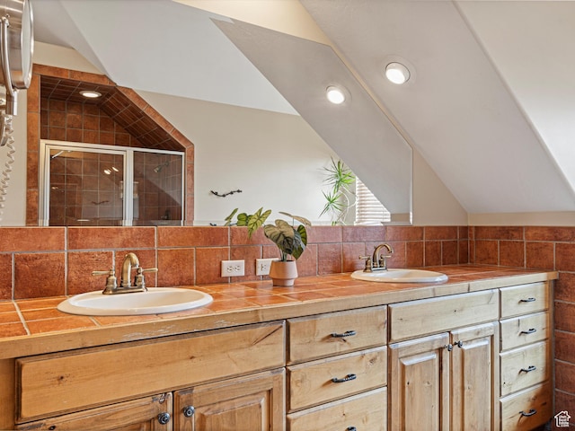 1173 S Innsbruck Dr, Huntsville, UT 84317 - full bath with double vanity, a sink, a shower stall, and vaulted ceiling