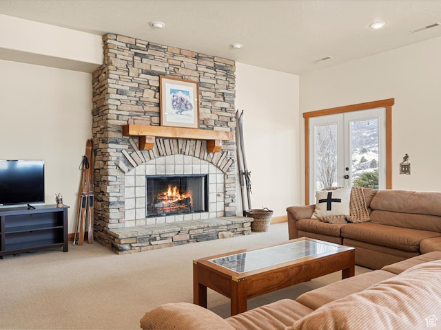 1173 S Innsbruck Dr, Huntsville, UT 84317 - carpeted living area featuring visible vents, a stone fireplace, french doors, and recessed lighting