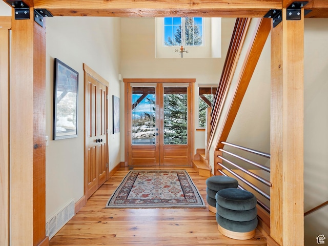 1173 S Innsbruck Dr, Huntsville, UT 84317 - foyer entrance with a towering ceiling, visible vents, and light wood-type flooring