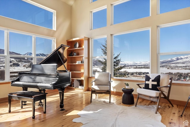 1173 S Innsbruck Dr, Huntsville, UT 84317 - living area with a mountain view, wood-type flooring, and plenty of natural light