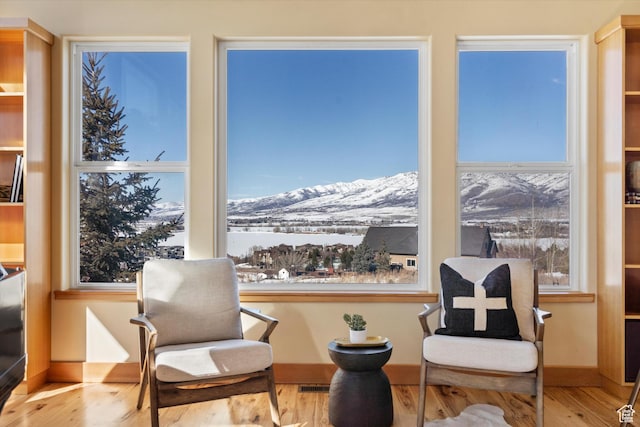 1173 S Innsbruck Dr, Huntsville, UT 84317 - sitting room featuring a mountain view, visible vents, wood finished floors, and baseboards