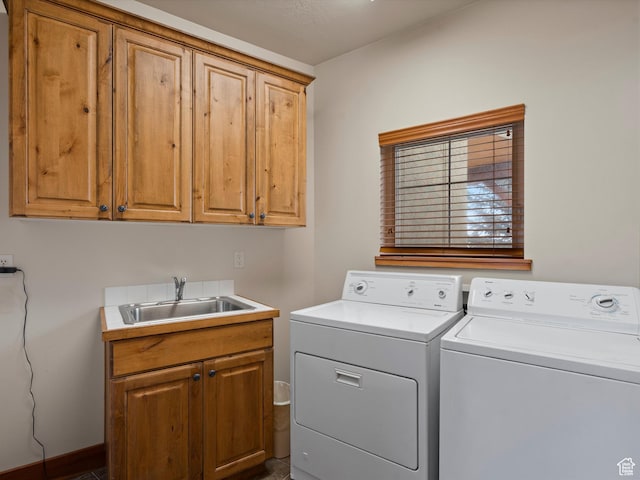 1173 S Innsbruck Dr, Huntsville, UT 84317 - clothes washing area with washer and dryer, cabinet space, and a sink