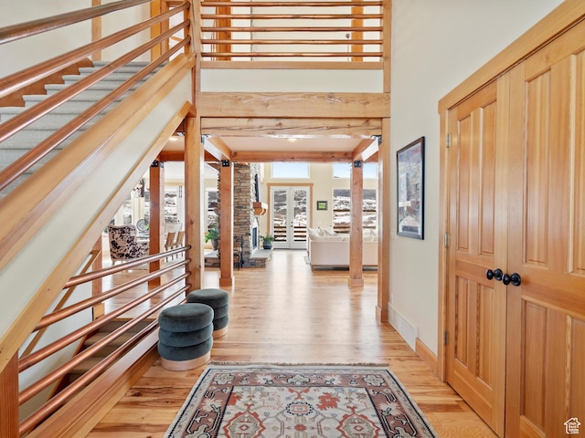 1173 S Innsbruck Dr, Huntsville, UT 84317 - corridor featuring stairs, baseboards, french doors, and light wood-style floors